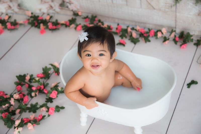 Oahu Family Photographer, baby girl in a milk bath tub